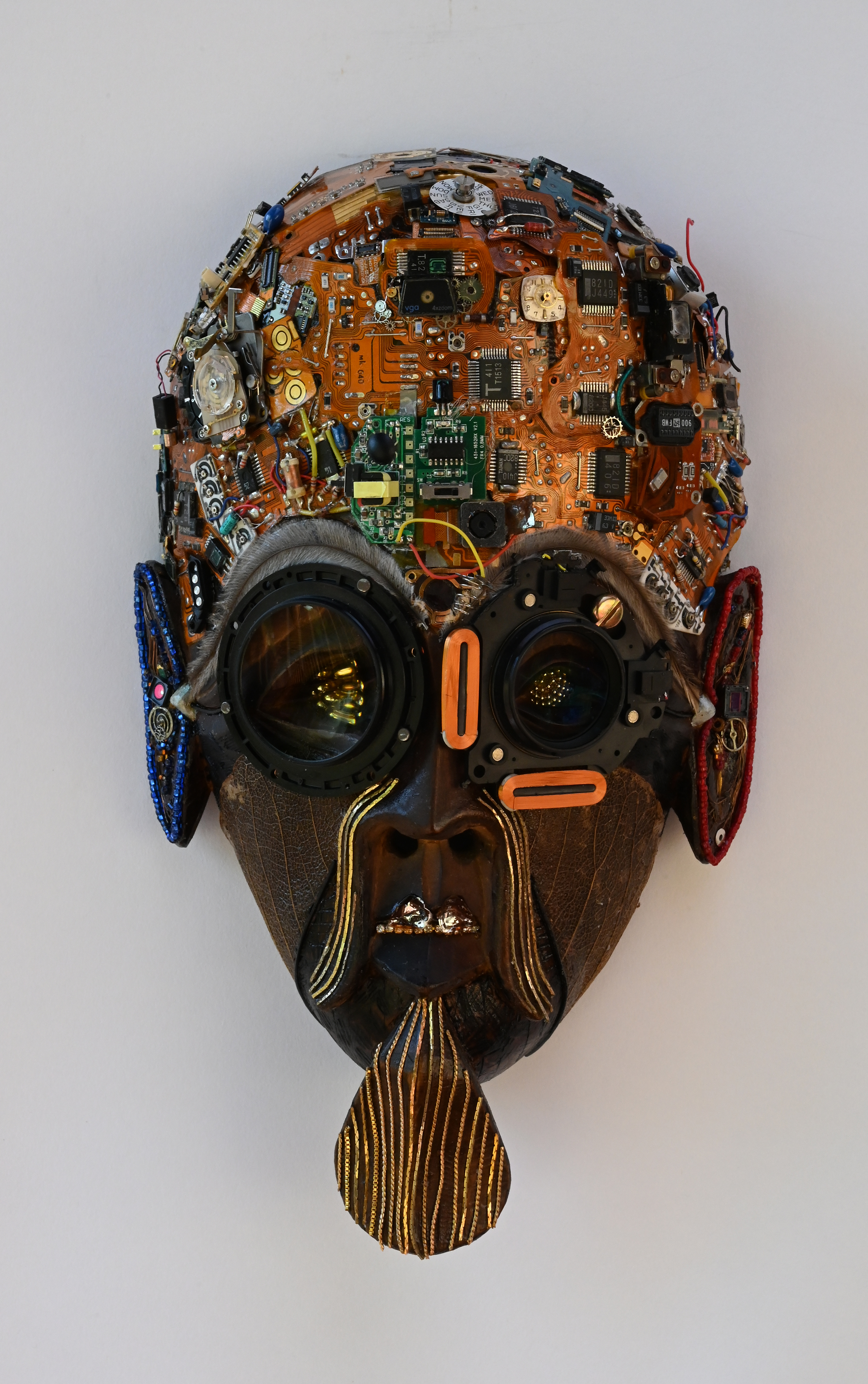 Mixed media sculpture entitled Evo Chip Tribe